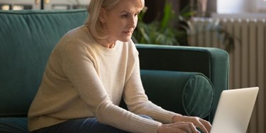 Concerned woman looking at laptop