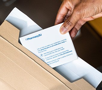 Removing prescription items from a cardboard envelope